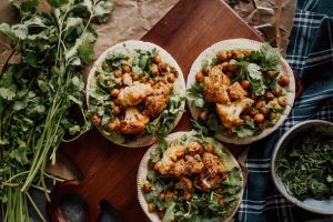 Delicious vegan tacos featuring roasted cauliflower and chickpeas with cilantro, perfect for a healthy meal.